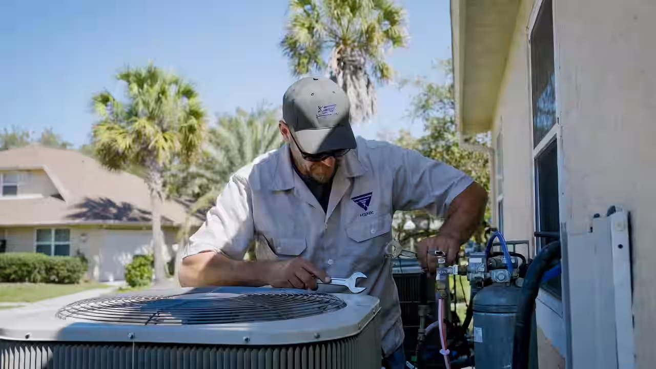 HVAC contractor inspecting ductwork and system components